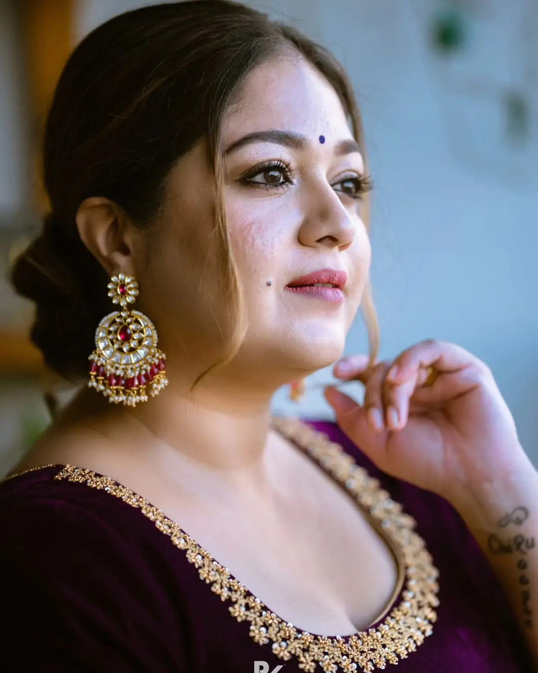 Meghana Raj Stills in Maroon Designer Gown